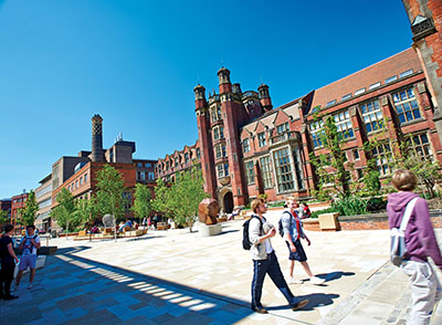 Student walking outside Armstrong building
