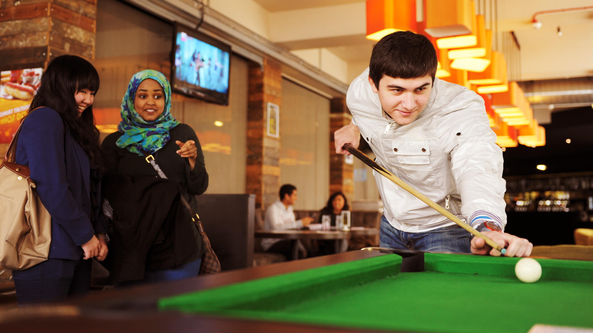 Students playing pool at the students' union at the University of Manchester