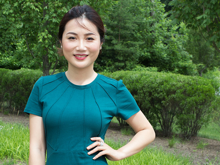 Mason female student posing for camera outdoors