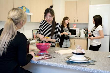 International students cooking in Liberty Park shared kitchen at INTO Glasgow Caledonian University International students cooking in Liberty Park shared kitchen at INTO Glasgow Caledonian University