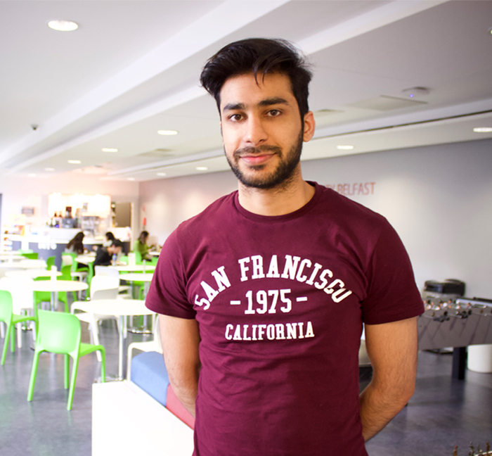 Image of student in cafe at INTO Queen's University Belfast