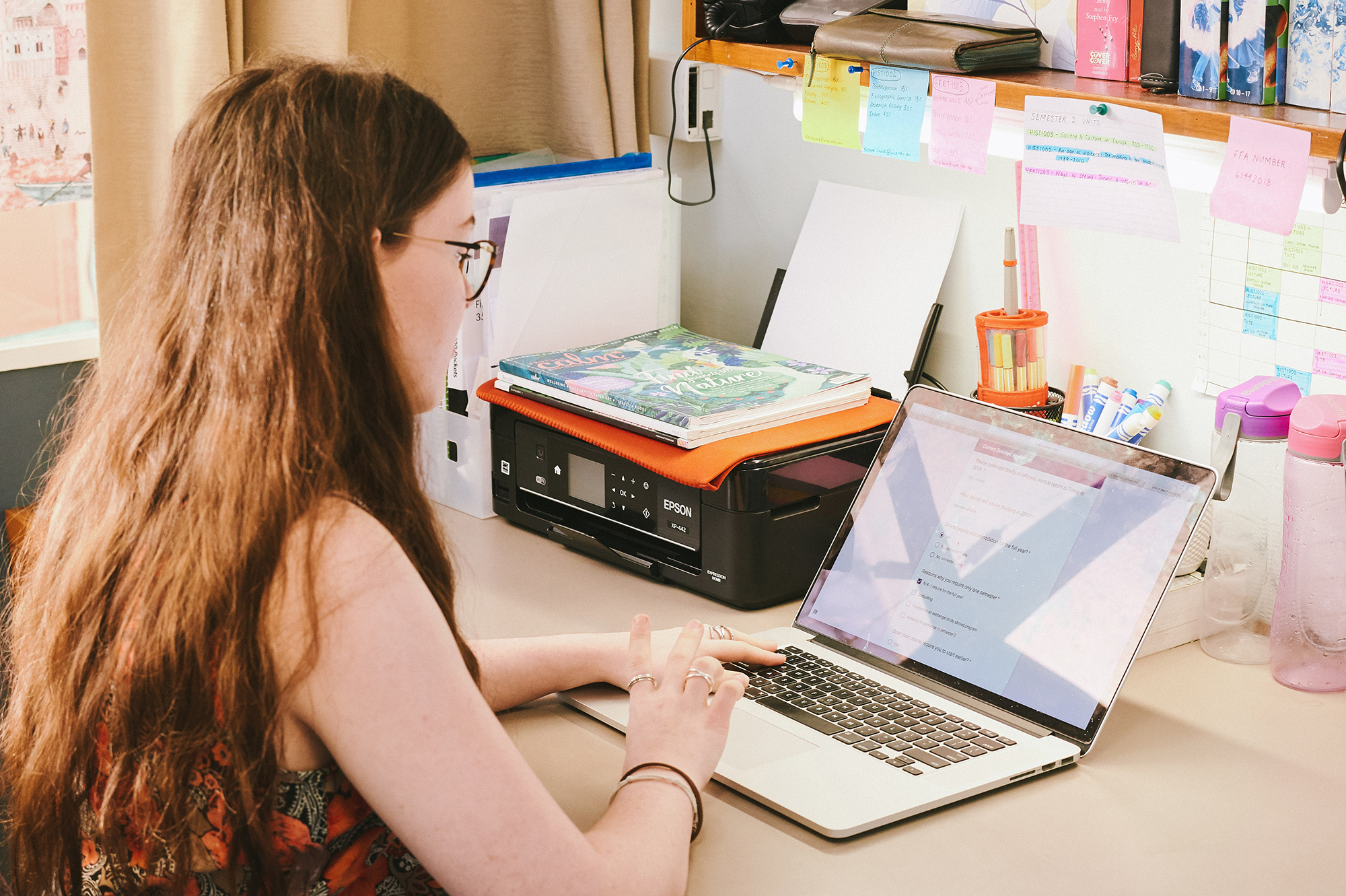 UWA Residential Colleges - Student studying in their room at Trinity College