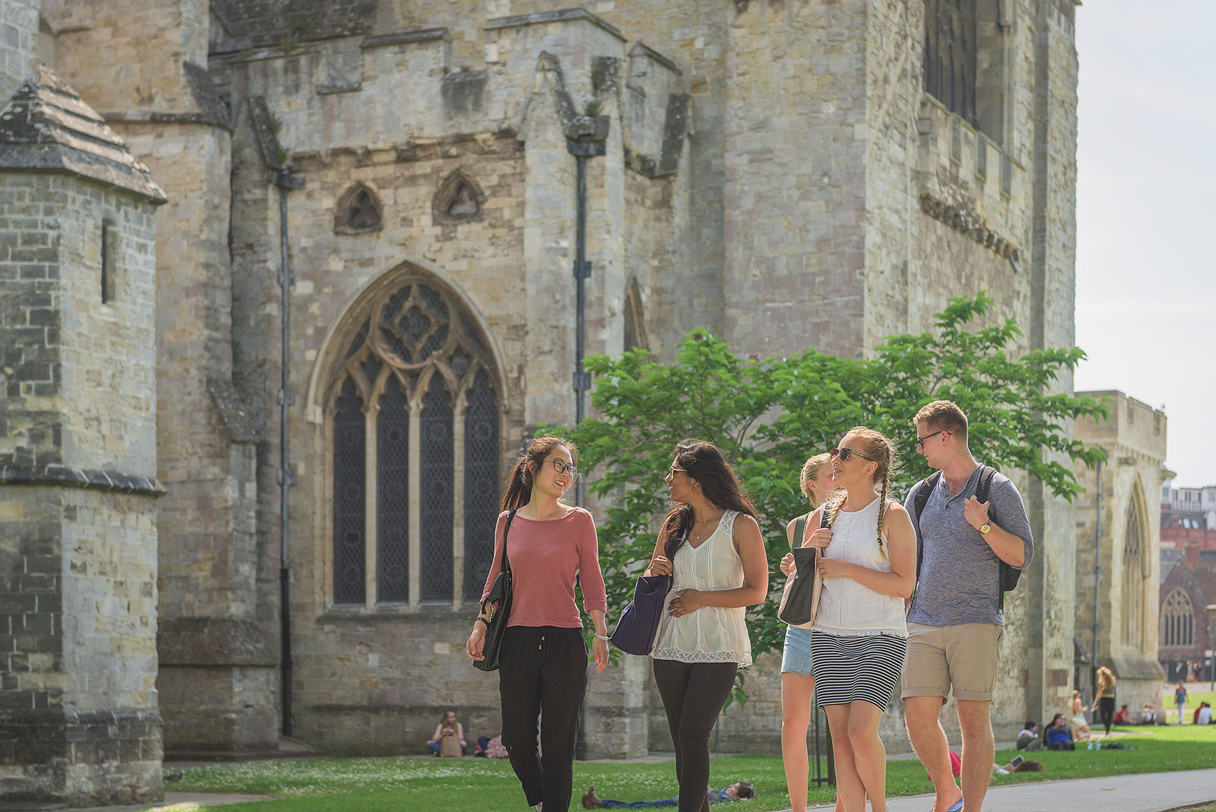 Students walking outside Exeter cathedral