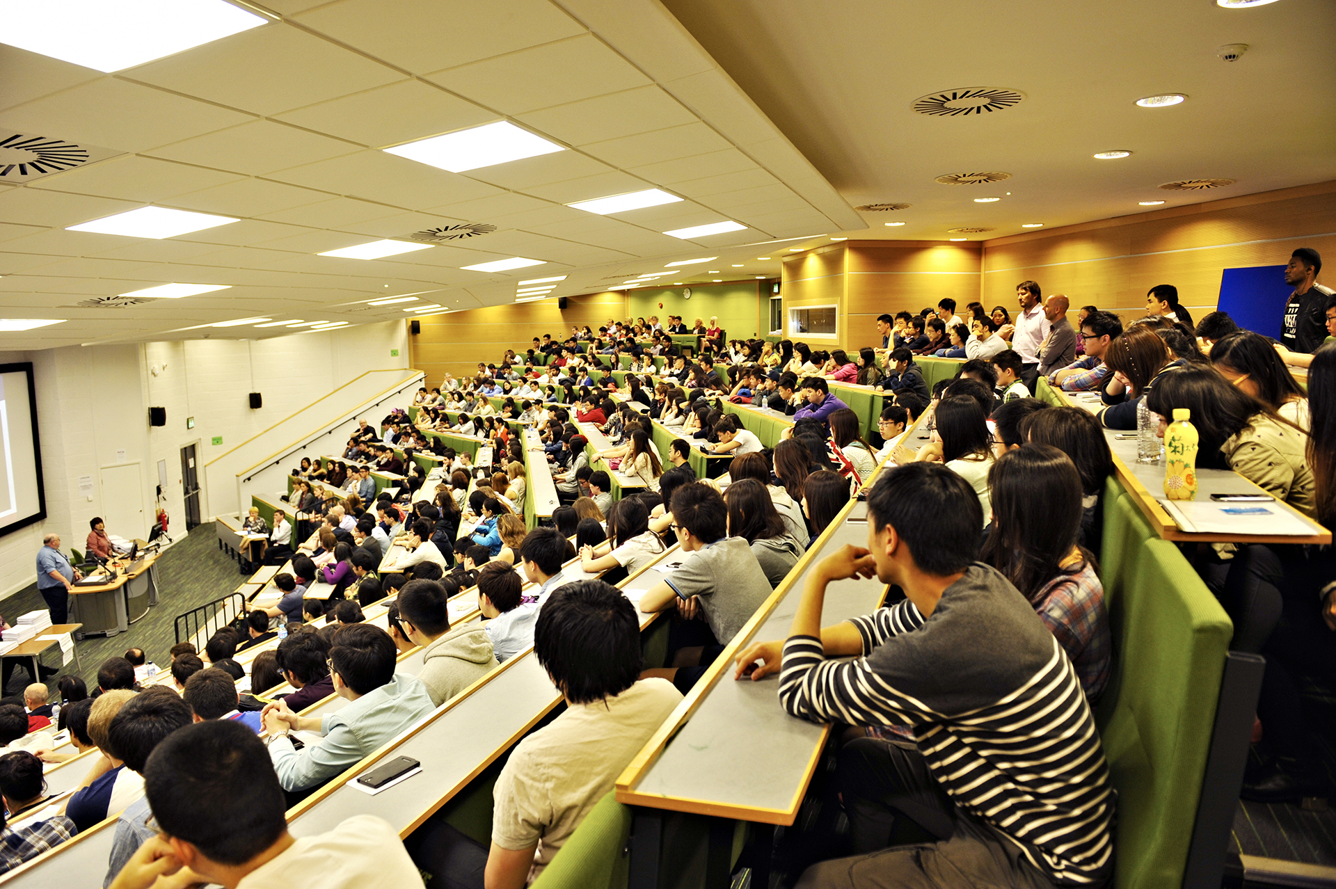 Students sat in large lecture hall for Economics and Finance