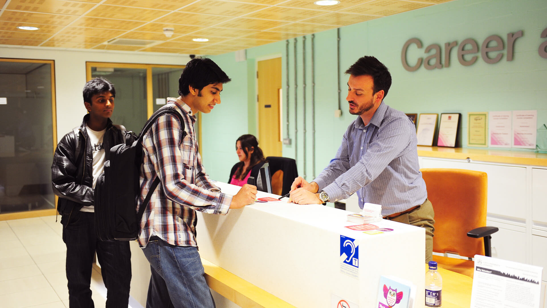 International student talking to a memeber of staff at the Student Hub Careers Service at City, University of London