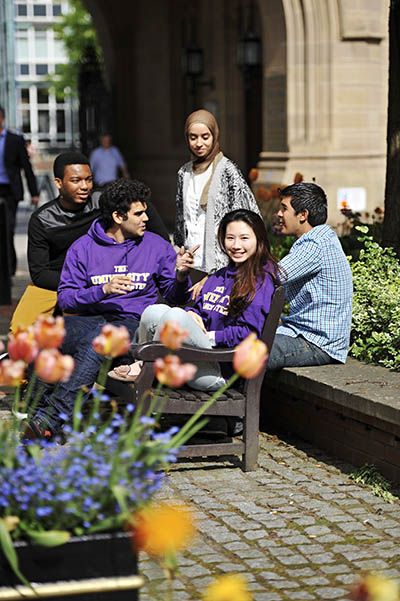 Student socialising outside on campus at The University of Manchester