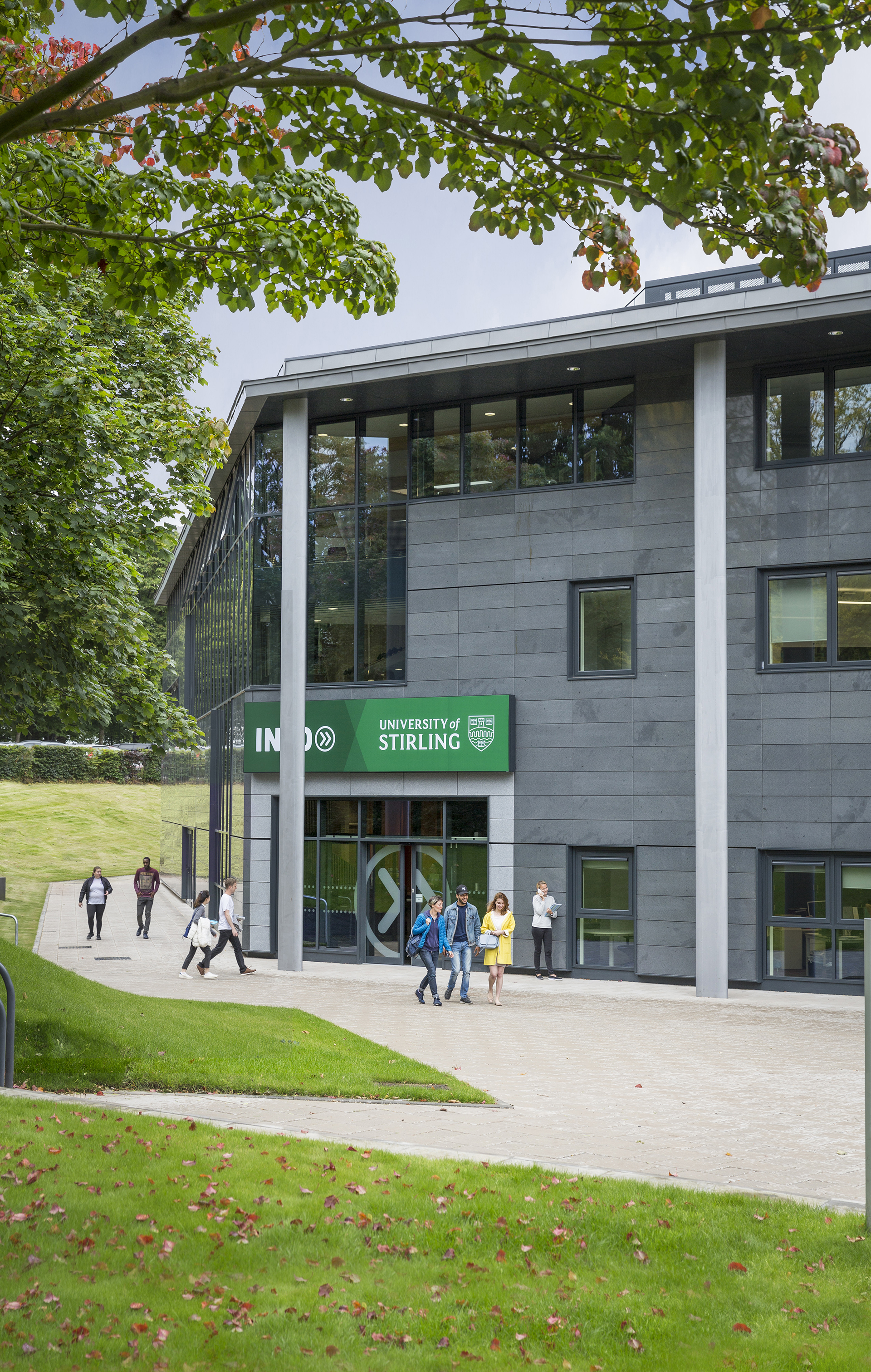 View of main entrance to the INTO Centre with international students outside