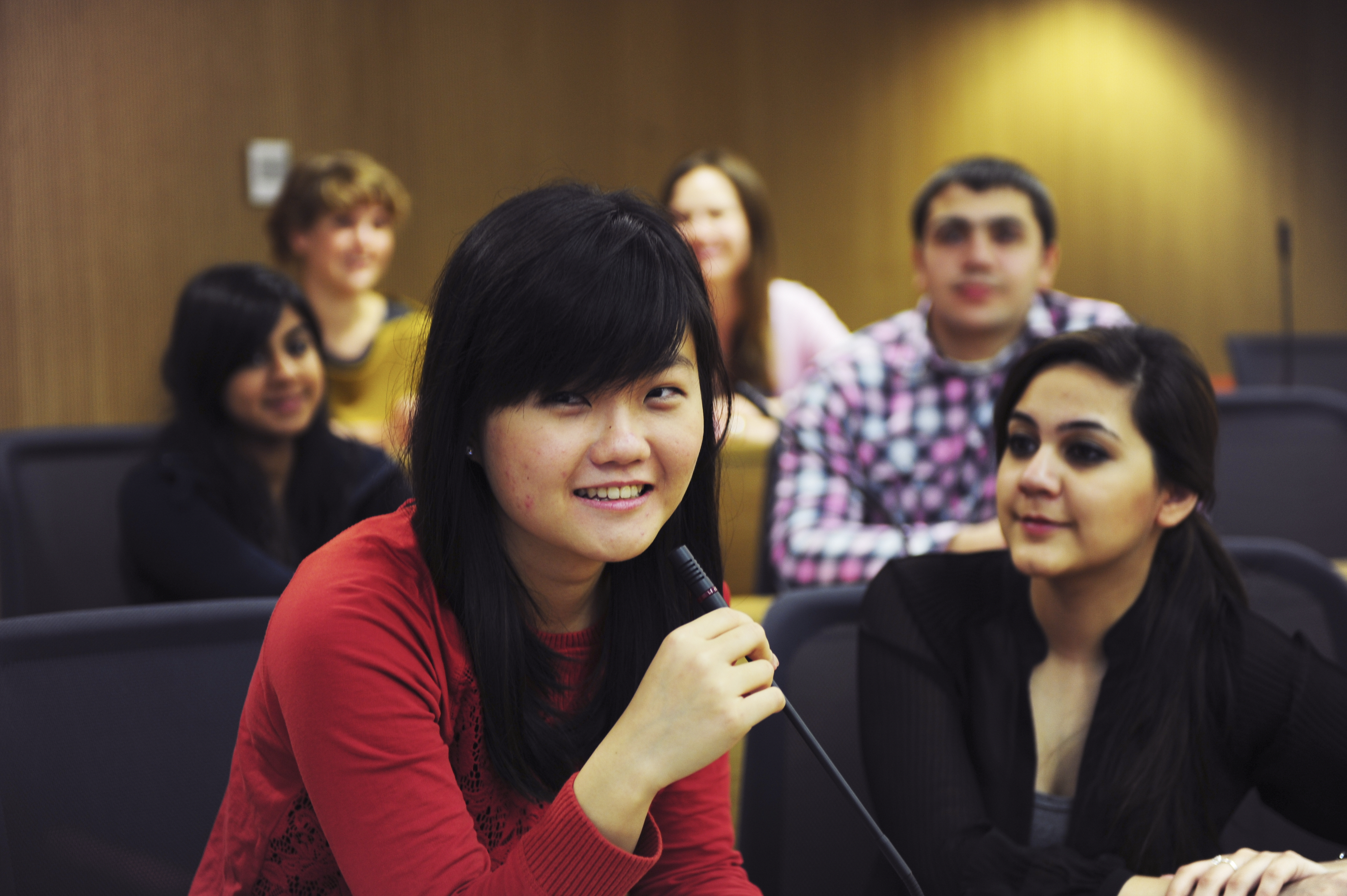 Student uses microphone in lecture theatre at University of Exeter