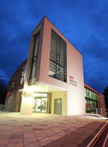 External view of University of Exeter INTO Centre in evening External view of University of Exeter INTO Centre in evening