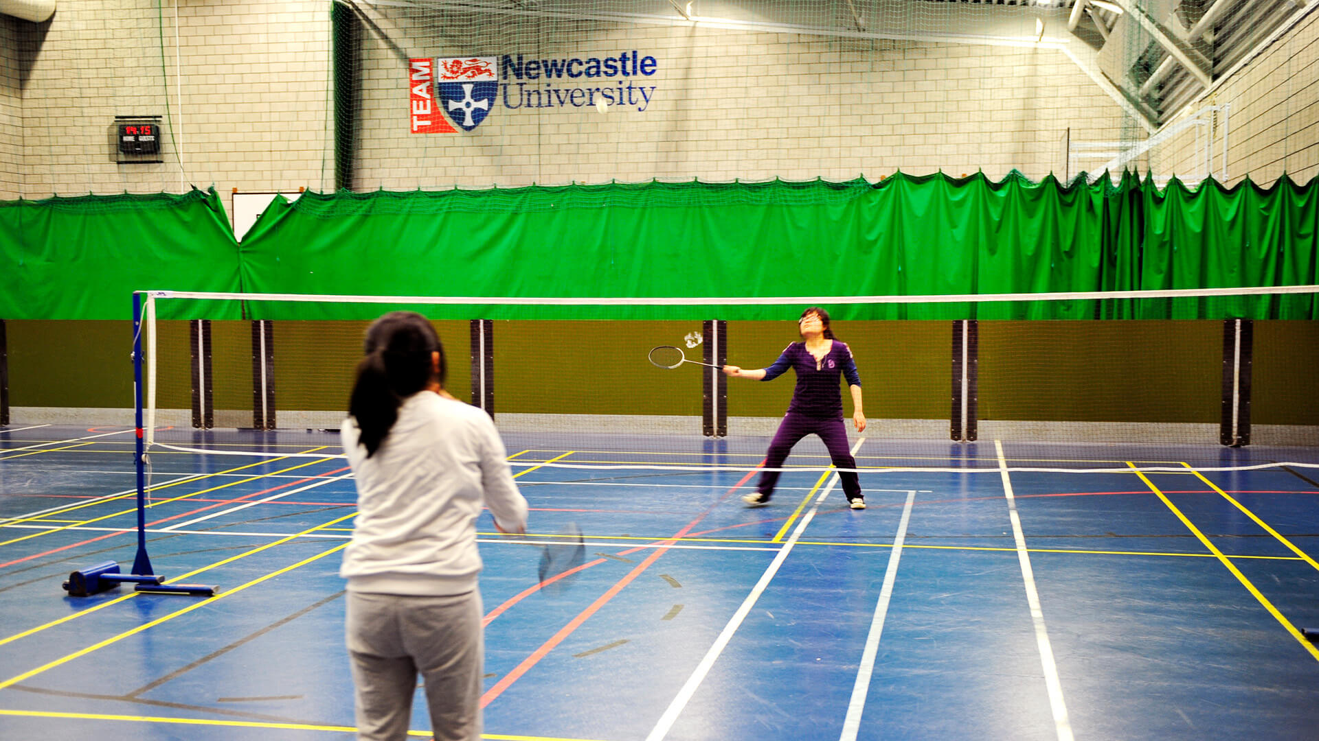 Students playing badminton at the Centre for Physical Recreation & Sport at Newcastle University