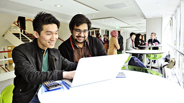 City students at a laptop