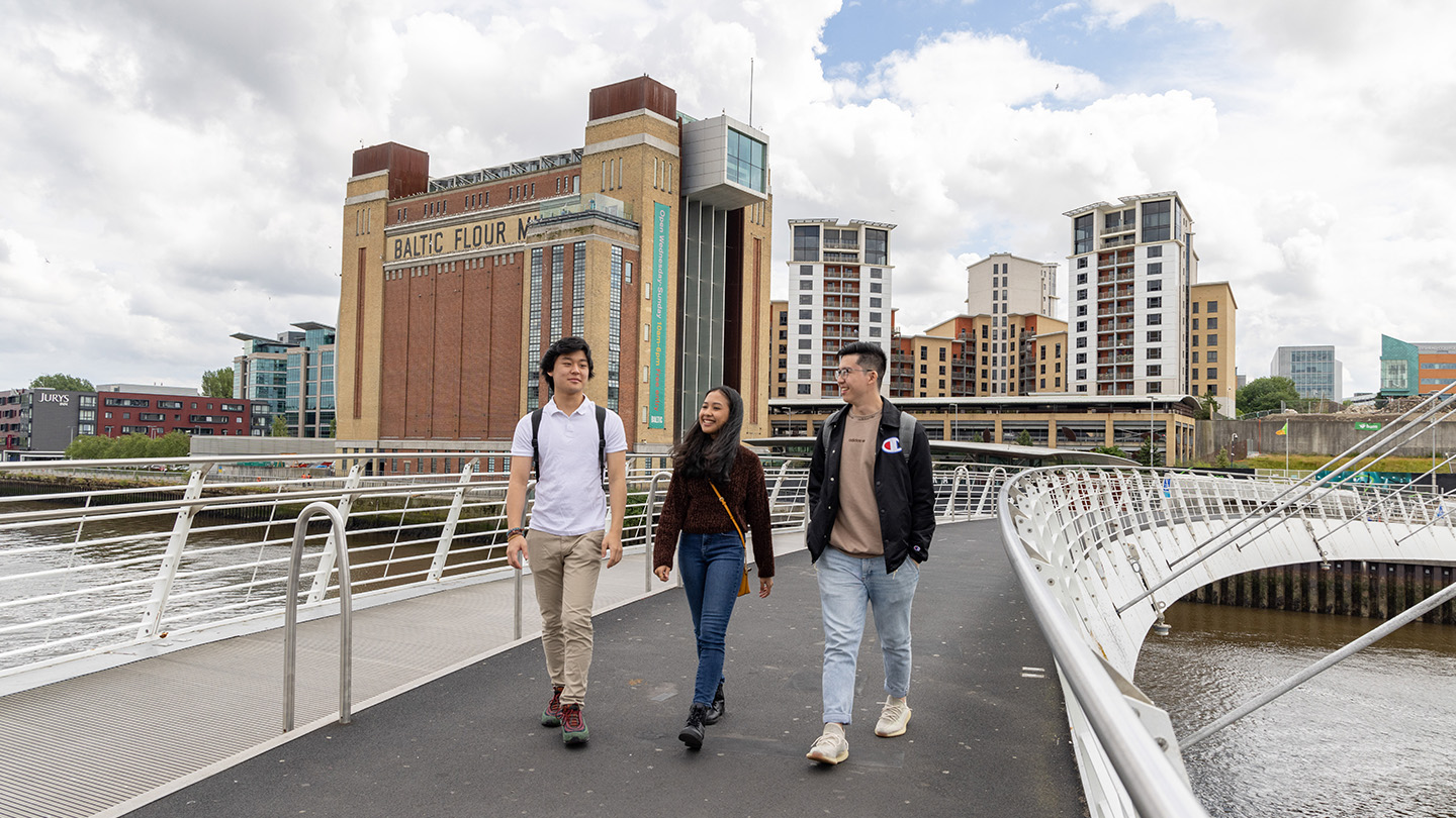 Three students walking through Newcastle city 