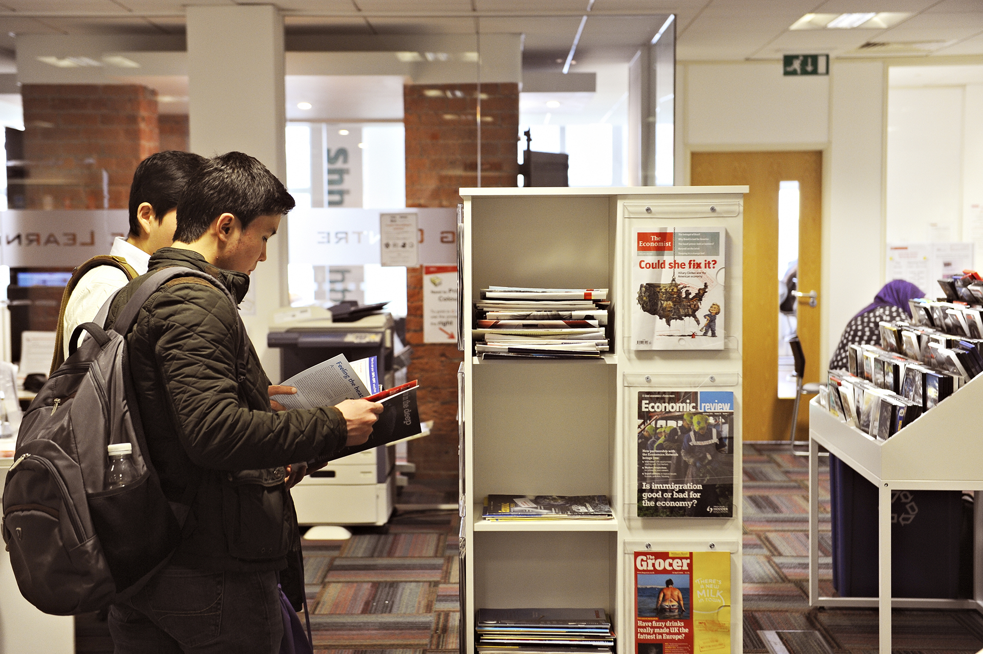 International students looking at resources in the Learning Resource Centre