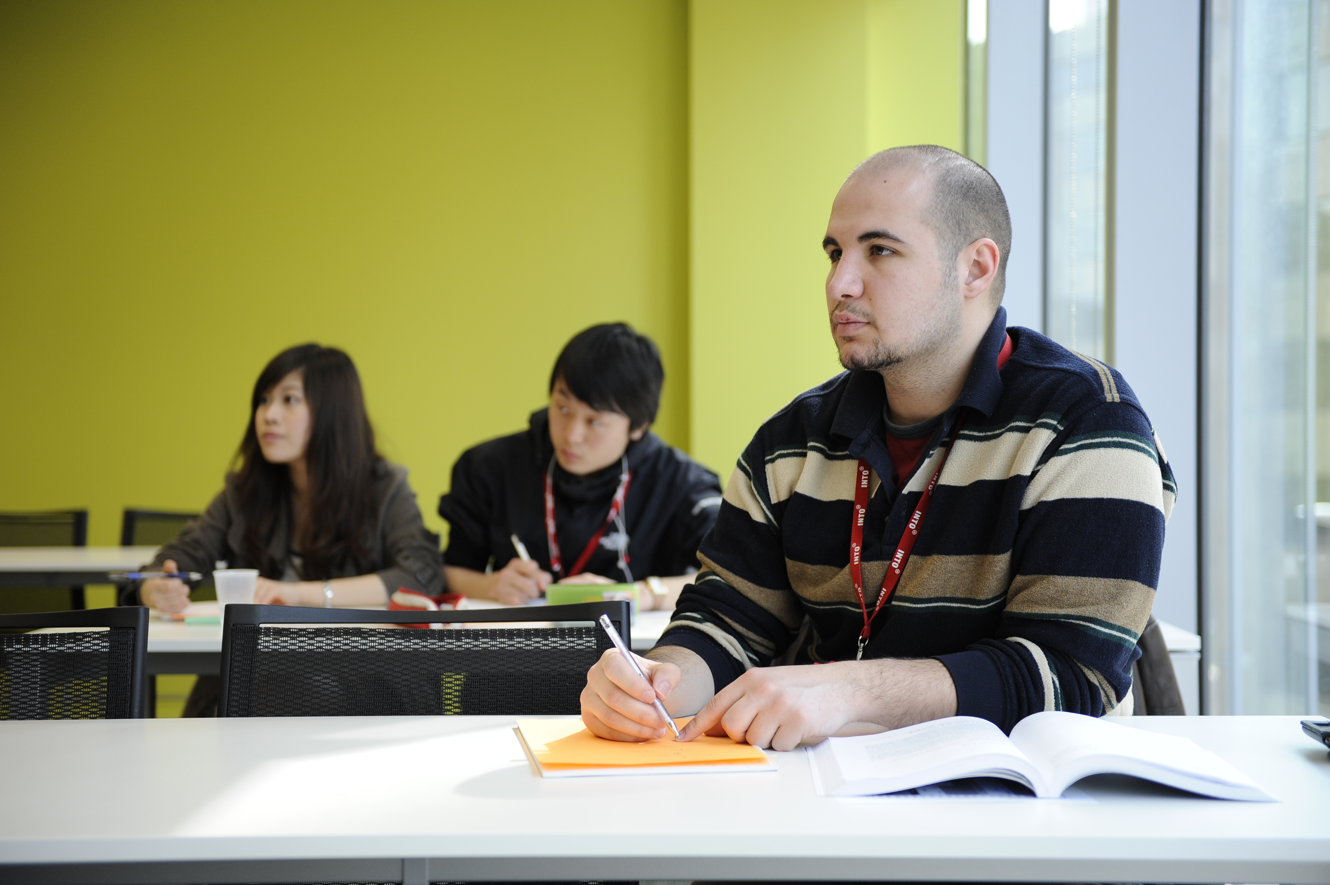 Three international students study LLB Law