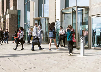 Students entering Kent university building entrance