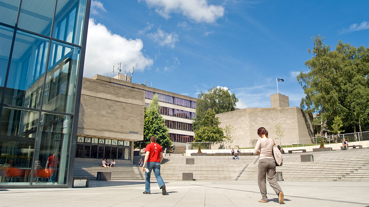 Students walking into the University of East Anglia entrance