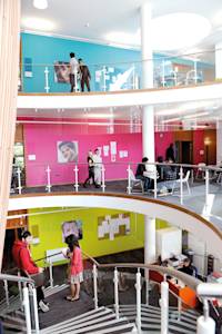 Inside INTO Centre with international students on staircase Inside INTO Centre with international students on staircase