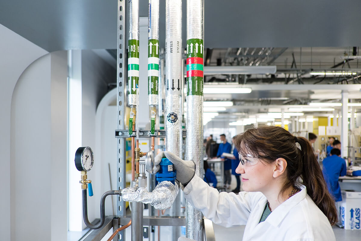 INTO international student using chemical engineering equipment