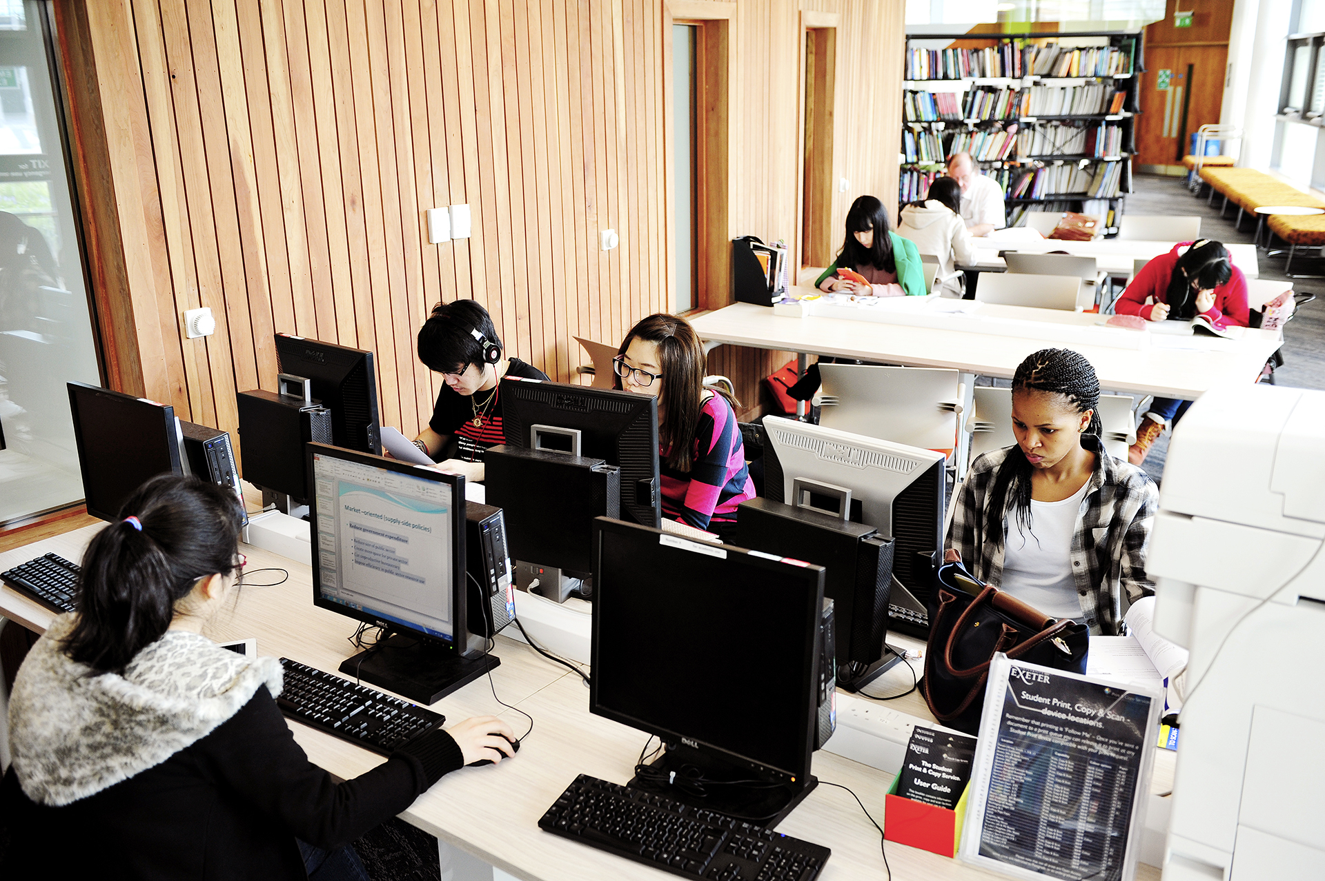 International students working at computer bank in Learning Resource Centre